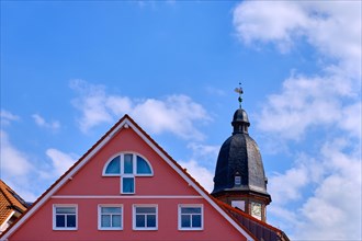 Roof structures and steeple of St. Mary's Church in the historic town centre of Waren an der Mueritz