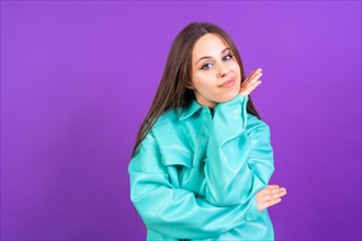 Thinking woman with many ideas with copyspace on purple background