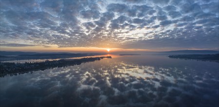 Lake Constance reflected in the morning sky with sunrise