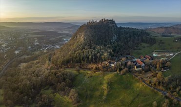 The volcanic cone with the Hohentwiel castle ruins illuminated by the morning sun