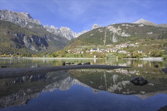 Mountains of the Brenta Group reflected in a small lagoon of Lake Molveno