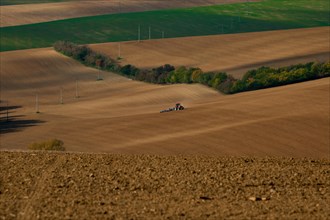 Work with an agricultural tractor in Moravian fields. Czech Republic