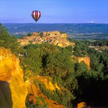Hot air balloon over the village of Roussillon