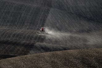 Harsh working conditions for agricultural tractors in Moravian fields in dust. Czech Republic