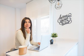 Businesswoman working with a computer pensive