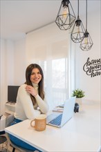 Portrait of businesswoman working with a computer