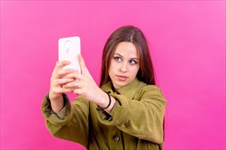 Isolated shot of a caucasian woman using a smartphone app