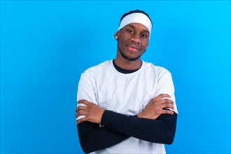 Black ethnic man in white clothes on a blue background