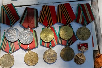 Veteran medals for their labour scattered on a table