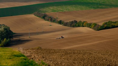 Work with an agricultural tractor in Moravian fields. Czech Republic