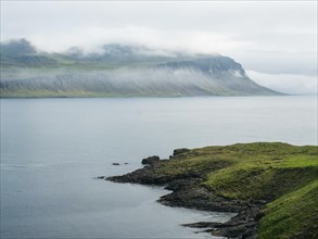 Fog over a fjord