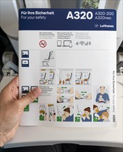 Boarding card with safety instructions in a Lufthansa A320 aircraft