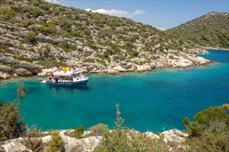 Excursion boat in lonely bay in Turkish Aegean Sea
