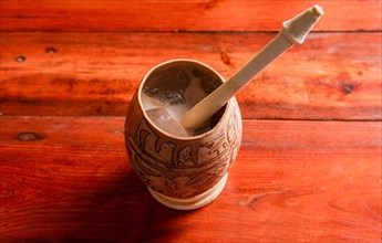 Nicaraguan cocoa drink in artisan jicara. Nicaraguan cocoa drink served in a traditional gourd. Concept of traditional drinks from Nicaragua and latin america