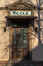 Entrance door to a primary school in a small village. Alsace