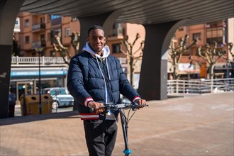 Black ethnic male skateboarding on an electric skate