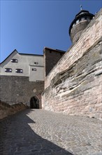 Paved road to the Kaiserburg on the left of the Sinwell Tower