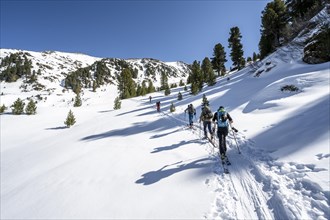 Group of ski tourers on the ascent in Schartlestal