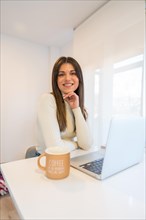 Portrait of businesswoman working with a computer