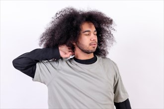 Suffering from cervical pain. Young man with afro hair on white background