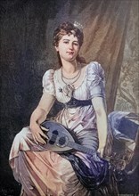 Young elegant woman with a mandolin playing music