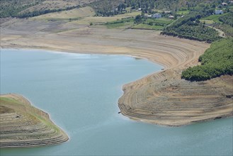 Little water in the Fierza reservoir with dry shore