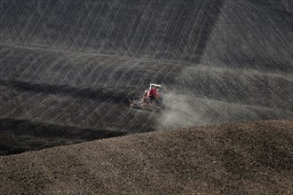 Harsh working conditions for agricultural tractors in Moravian fields in dust. Czech Republic