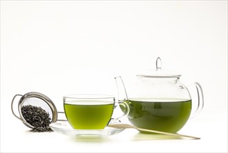 Green tea in glass pot and cup