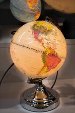 Little colorful model globe with maps on it