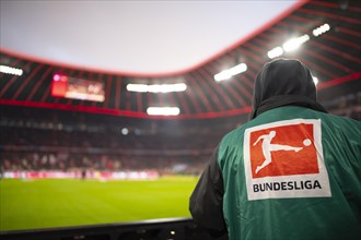 Cameraman with logo Bundesliga on TV camera