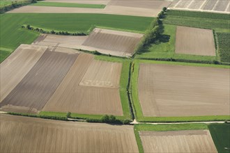 Aerial view over agricultural landscape showing fields