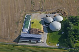 Aerial view over anaerobic digestion plant showing digesters with inflatable biogas holders