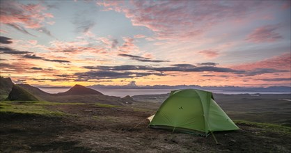 Tent overlooking rocky landscape Quiraing at sunrise