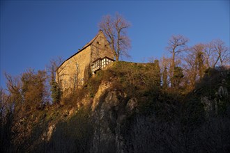 Klusenstein Castle on the sixty-metre-high cliff of the Hoenne Valley
