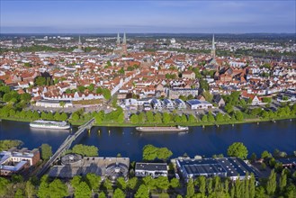Aerial view over the river Trave and old town and churches of the Hanseatic City of Luebeck in spring