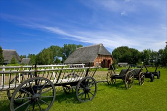 Ladder wagon and farmhouse