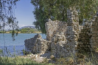 Ruined walls of ancient Roman city on the shore of Lake Butrint