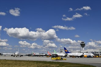 Aircraft parking on position at Terminal 1 with tower