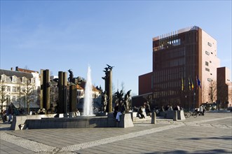 The concert hall and sculpture group with fountain at the square Het Zand in the city Bruges