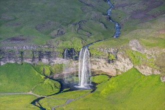 Aerial view over Seljalandsfoss waterfall and the Seljalands River in summer