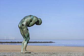 Sculpture Tomorrow Man Made by the Sea by artist Catherine Francois on groyne along the North Sea coast at Knokke-Heist