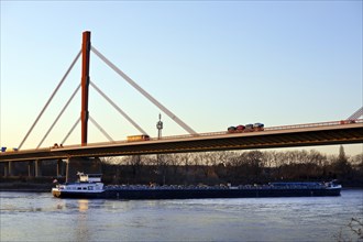 Ship traffic on the Rhine and motorway bridge A 42 with road traffic