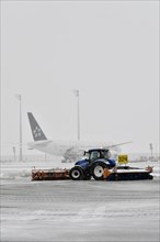 Snow clearing machines and snow removal tractors clearing snow on the east apron