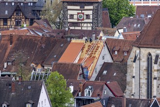 Roofers covering a roof in the historic old town of Esslingen am Neckar