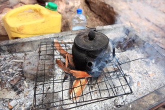 Tea pot on a campfire