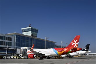 Air Malta Airbus A320 Neo in front of Satellite Terminal 2