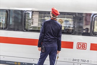 Arriving InterCityExpress ICE with uniformed Deutsche Bahn employee