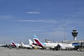 Aircraft parking on position at Terminal 1 with tower