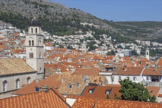 Red roofs of houses and bell tower of the Franciscan friary and church in the Old Town