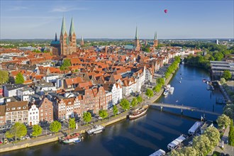 Aerial view over the river Trave and old sailing ships and boats in the old town of the Hanseatic City of Luebeck